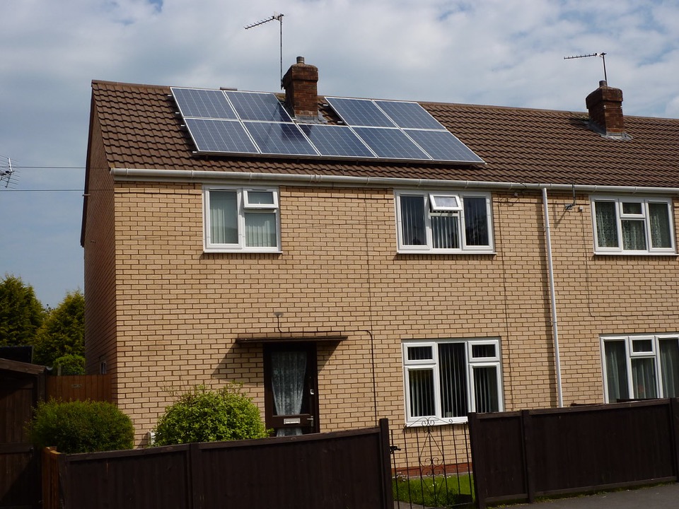 Solar panels on the tiled roof of a brick semi detached house at Whitnash in Warwickshire